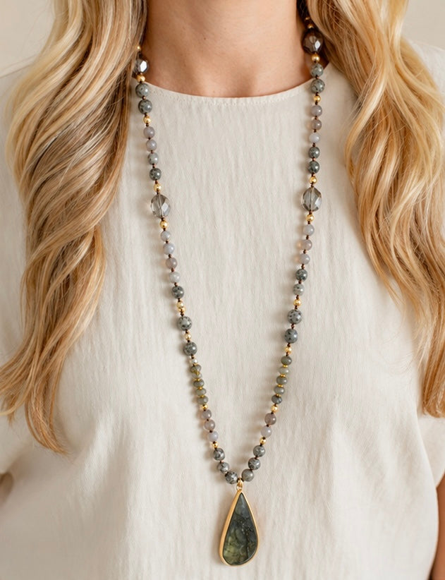 a woman wearing a necklace