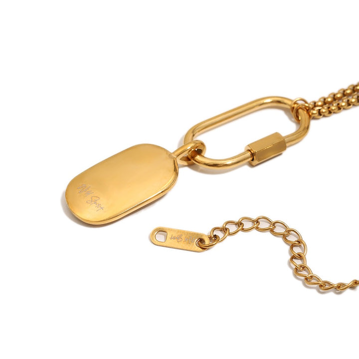 a gold chain with a tag
