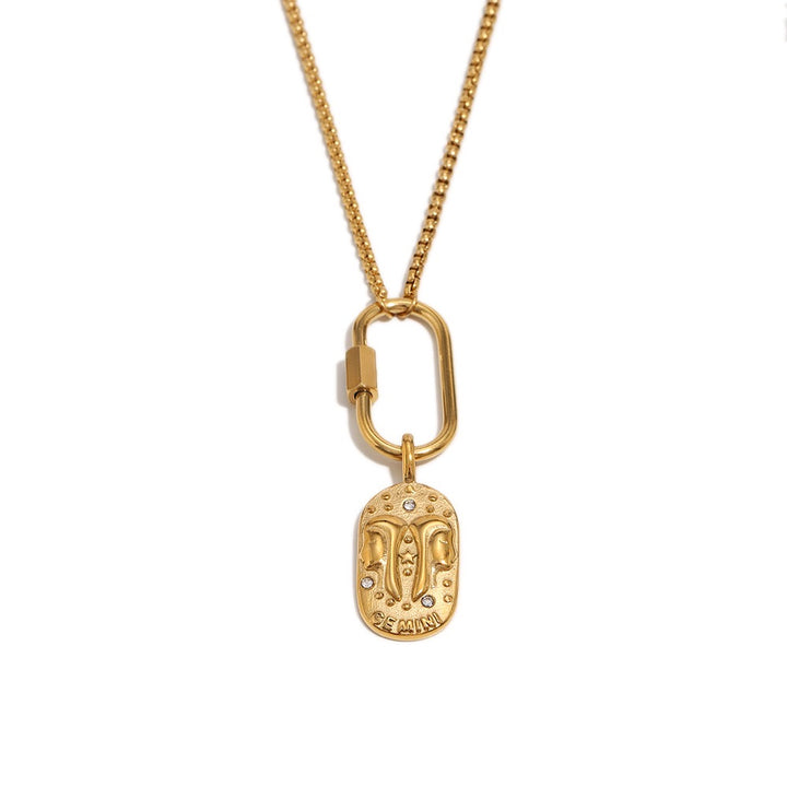 a gold necklace with a pendant