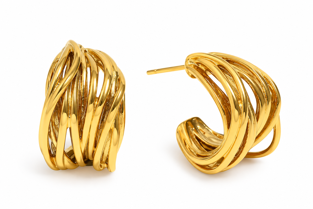 a pair of gold earrings