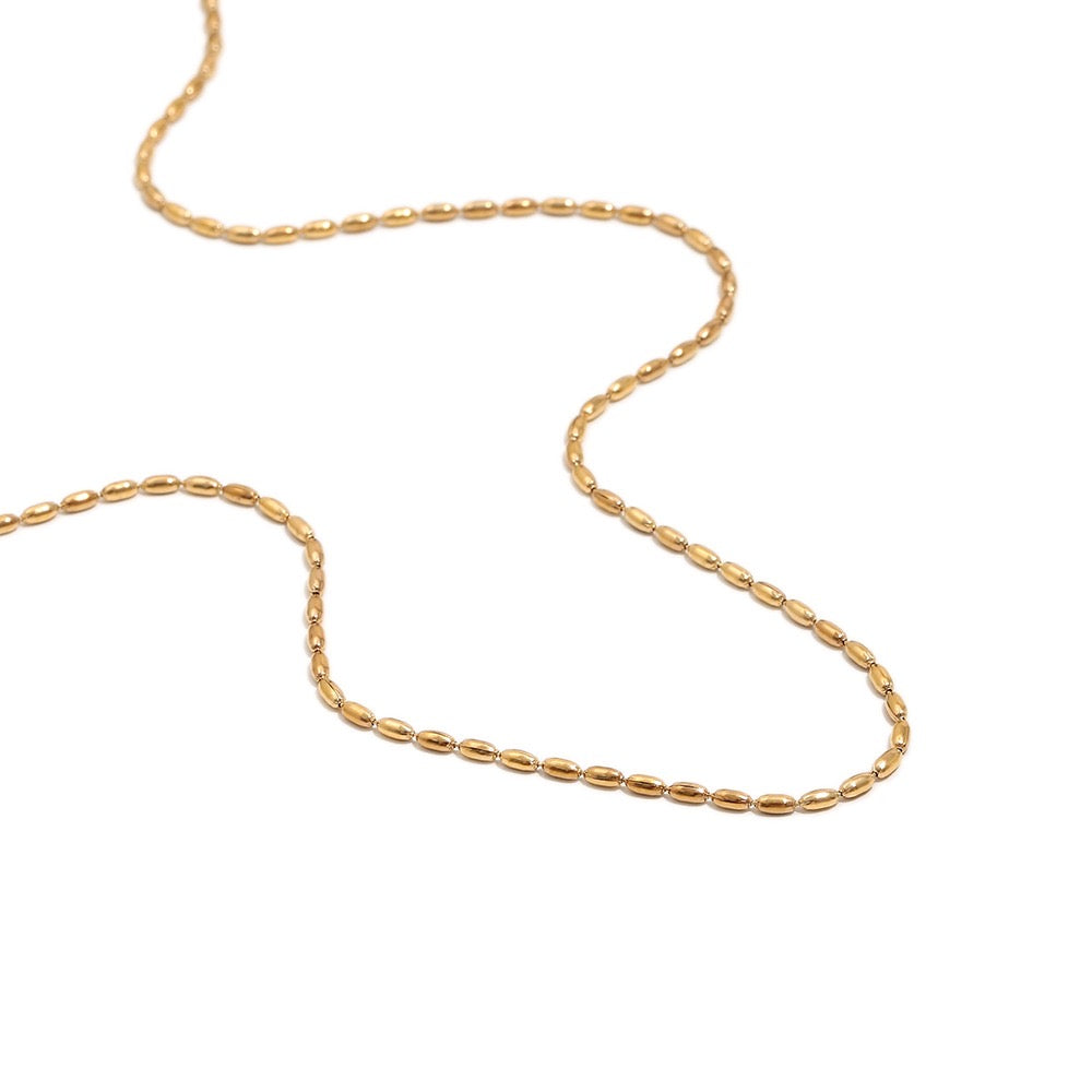 a gold chain on a white background