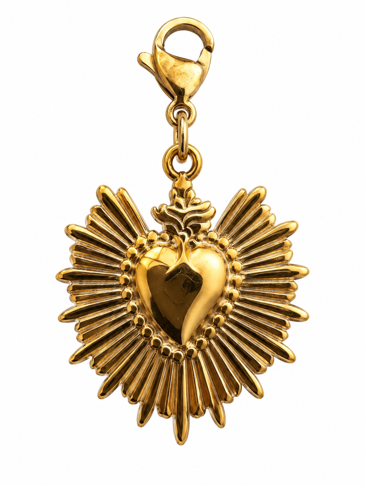 a gold heart pendant with a flower and a heart on it