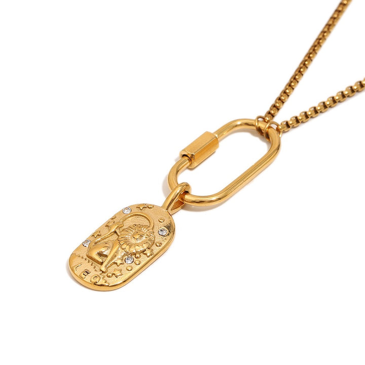 a gold necklace with a pendant