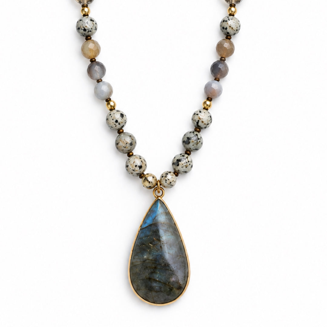 a necklace with a stone pendant