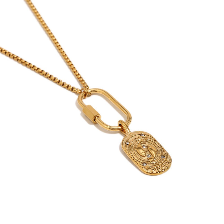 a gold necklace with a pendant