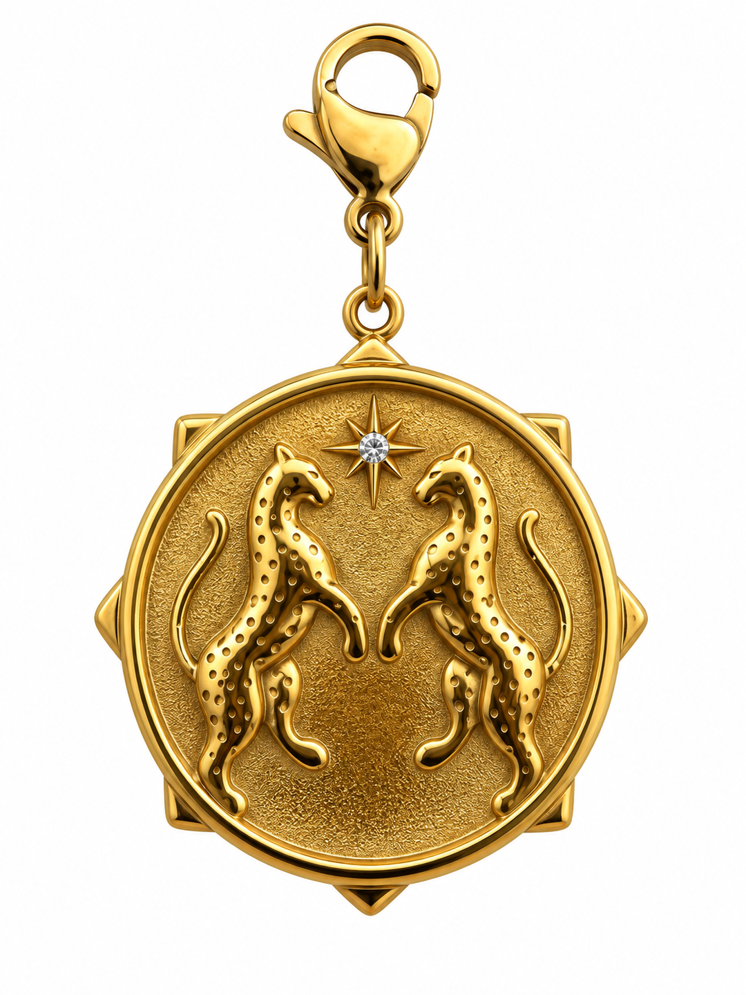 a gold pendant with a diamond and leopards