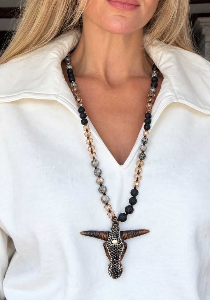 a woman wearing a necklace