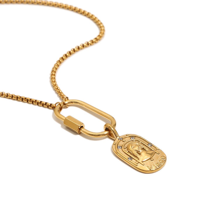 a gold necklace with a pendant