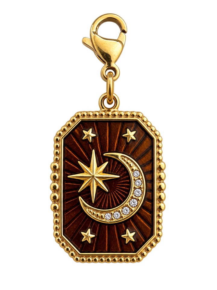 a gold medallion with a moon and stars
