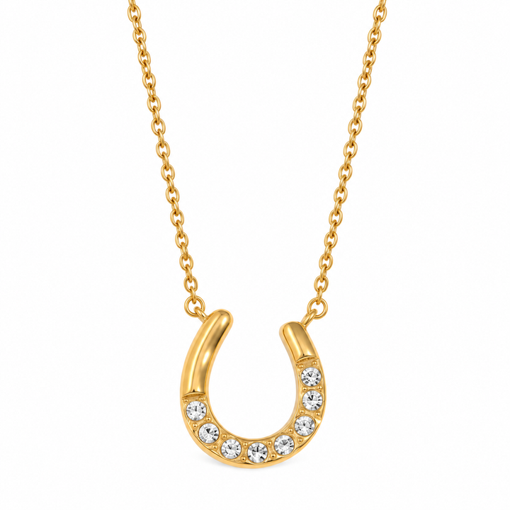 a gold horseshoe necklace with diamonds