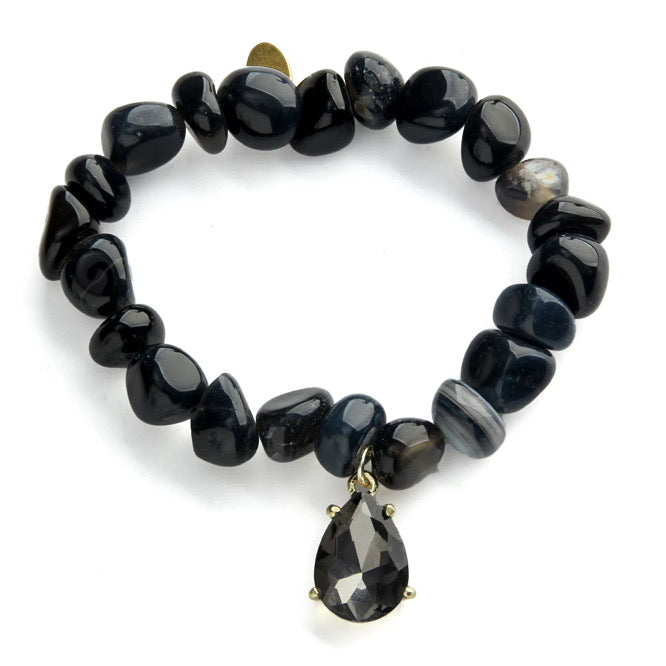 a black bracelet with a pendant