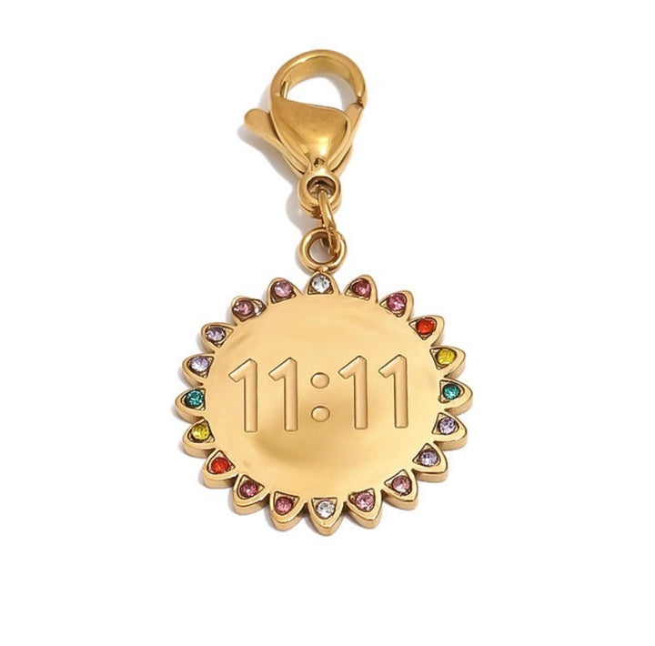 a gold medallion with multicolored stones
