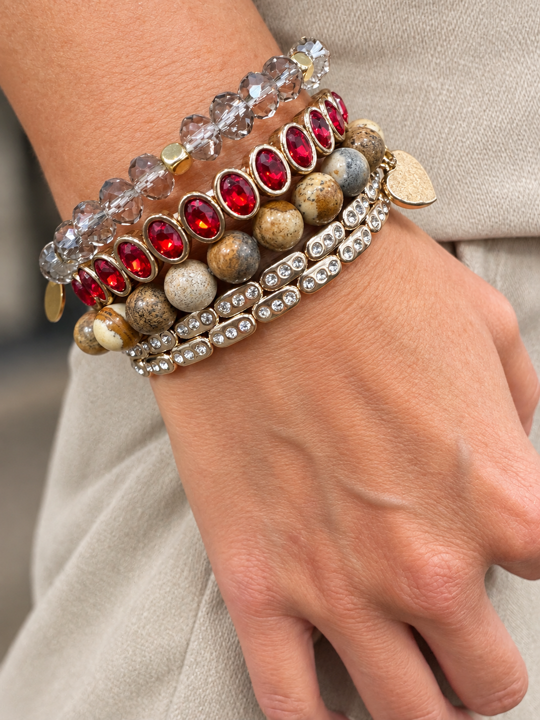 a hand with bracelets on it