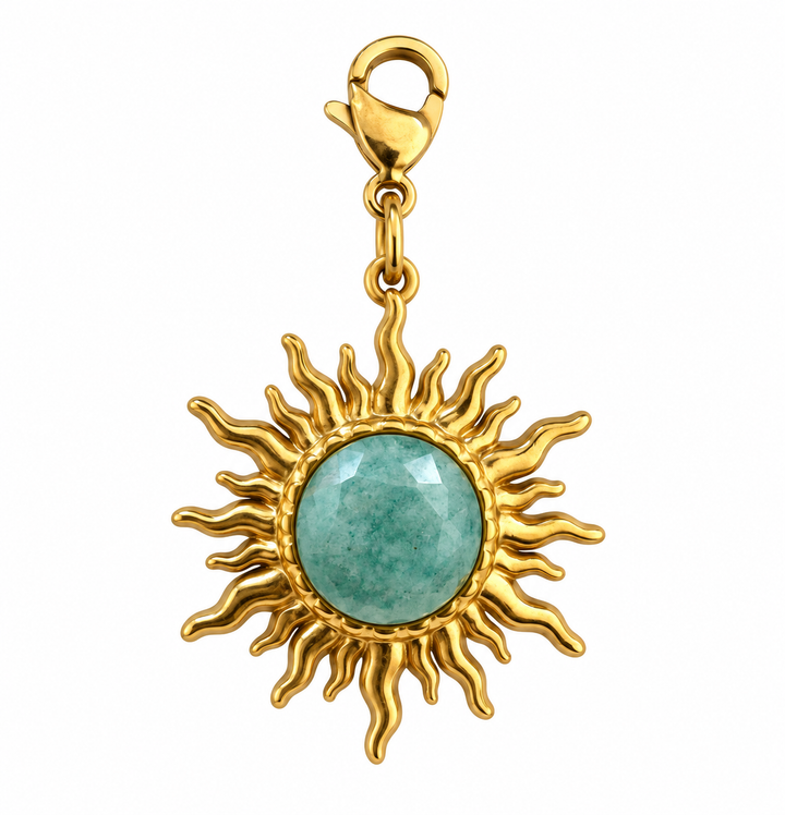 a gold sun with a blue stone