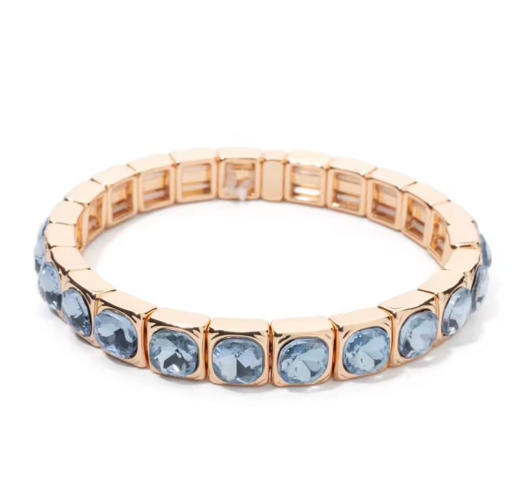 a gold and blue bracelet