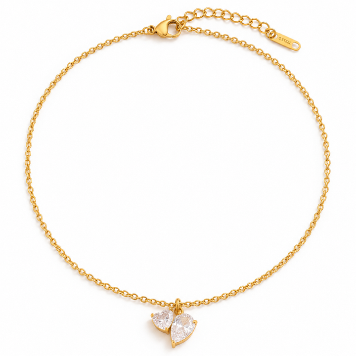 a gold chain with a heart pendant