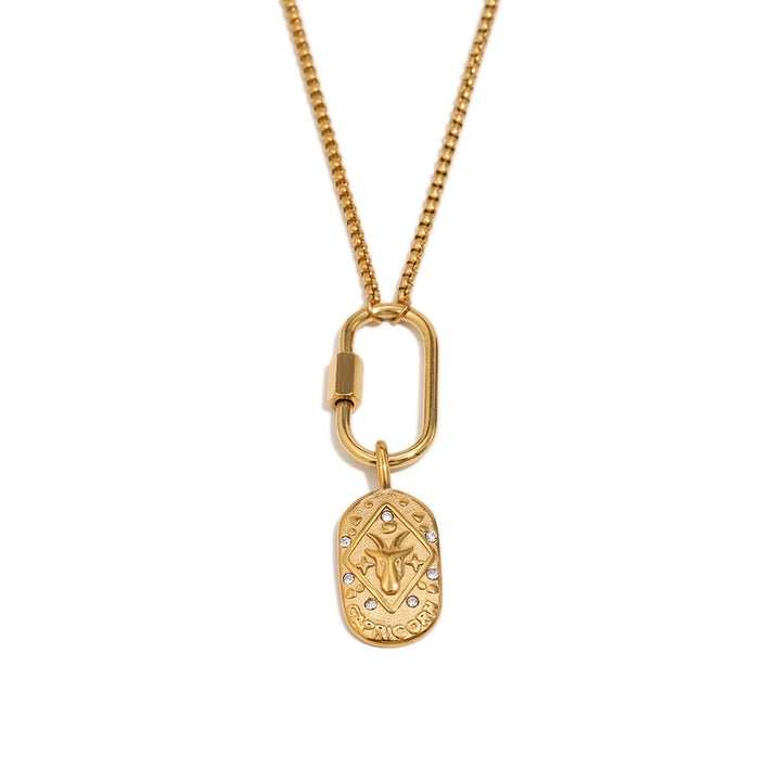a gold necklace with a pendant