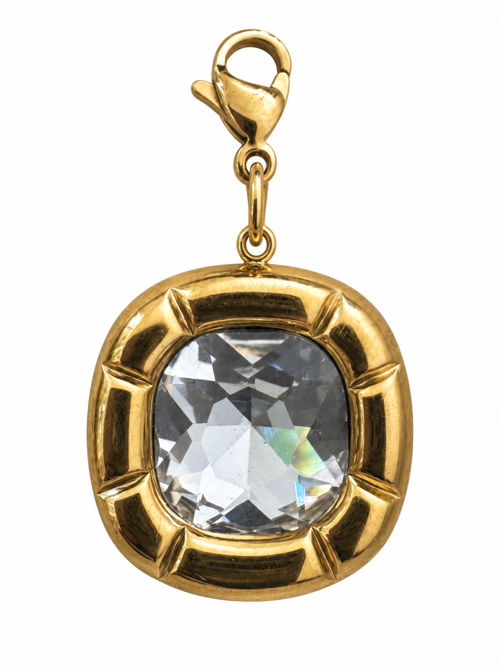 a gold necklace with a large diamond in it