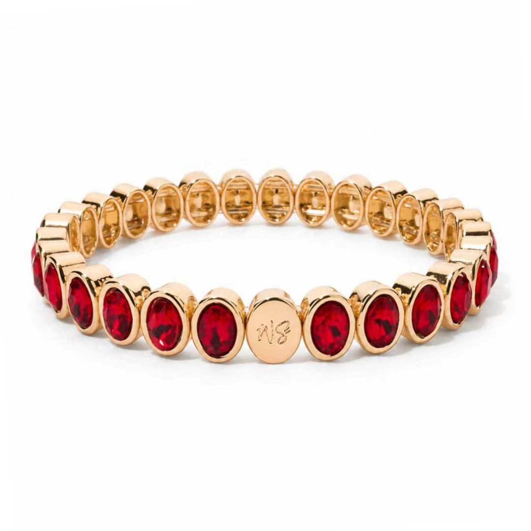 a gold and red bracelet