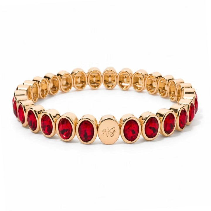 a gold and red bracelet