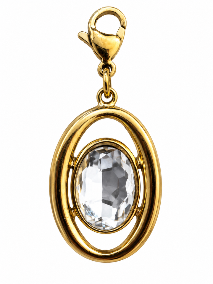 a gold pendant with a large stone in it