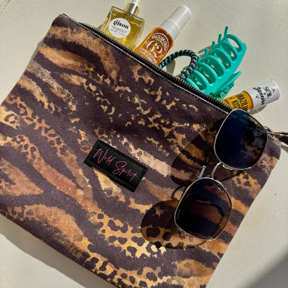 a bag with sunglasses and other items on it