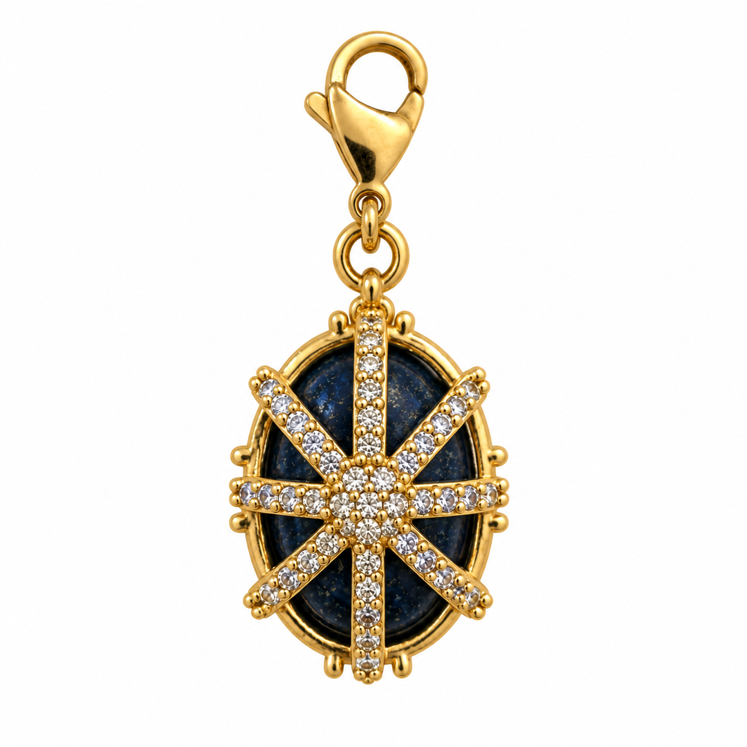 a gold and diamond pendant with a blue stone and a star
