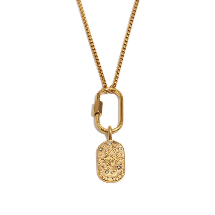 a gold necklace with a tag on it