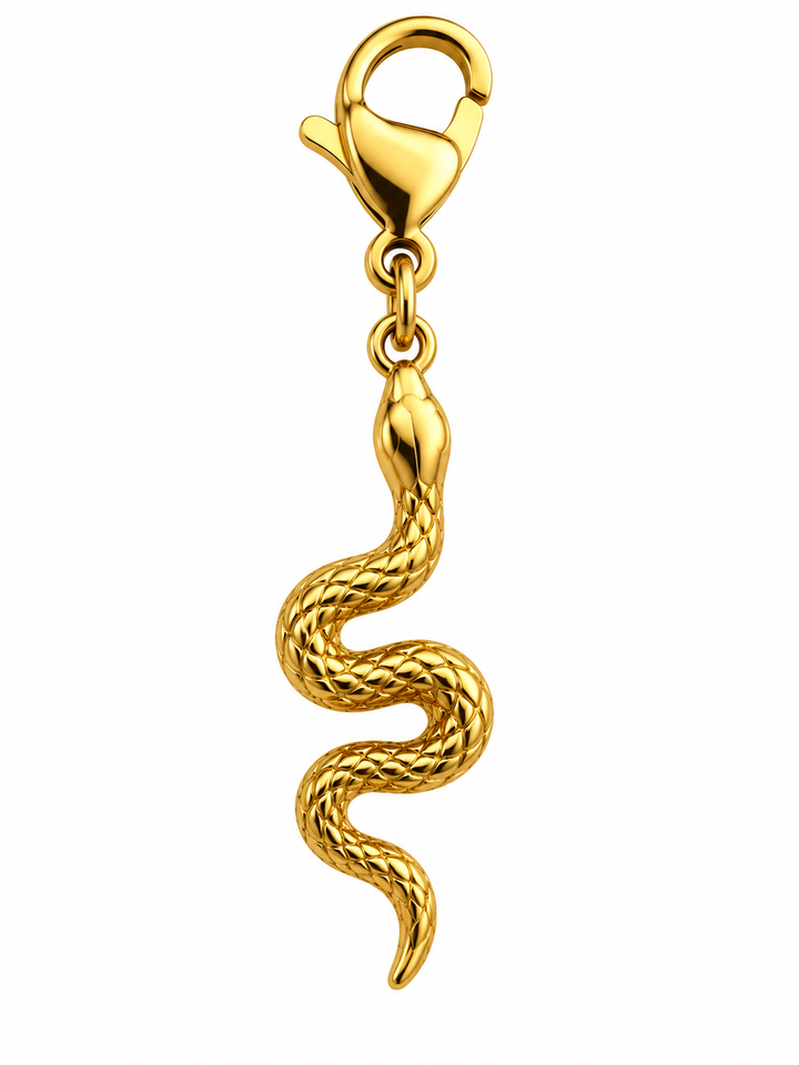a gold snake charm on a white background