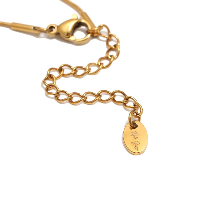 a gold chain with a tag