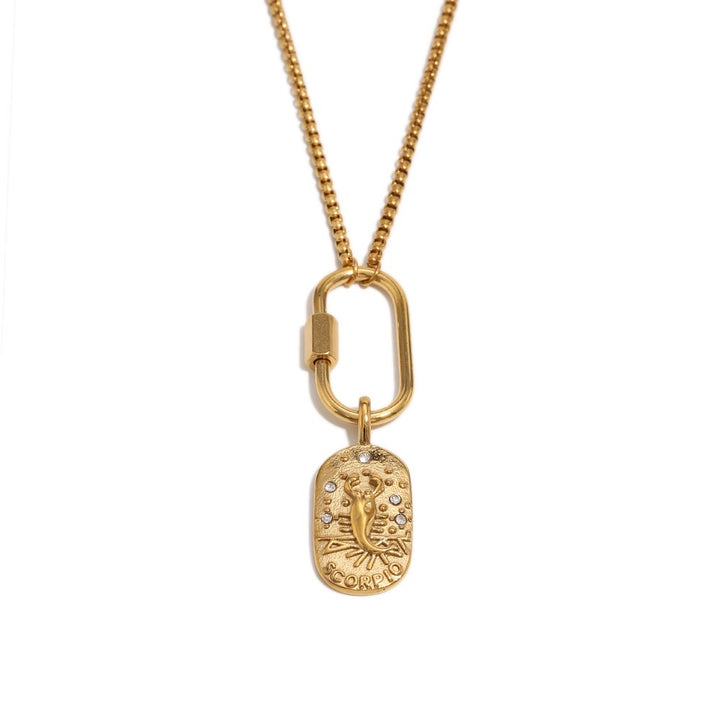 a gold necklace with a pendant