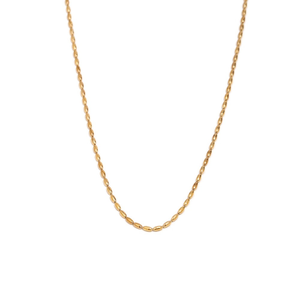 a gold chain on a white background