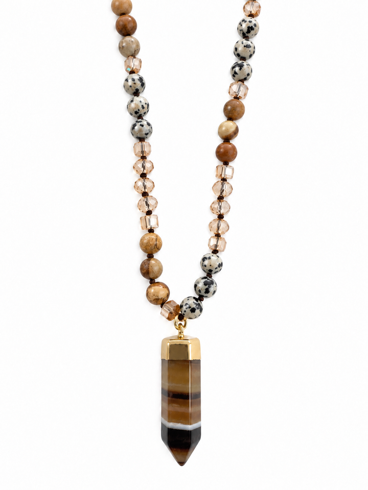 a necklace with a stone pendant