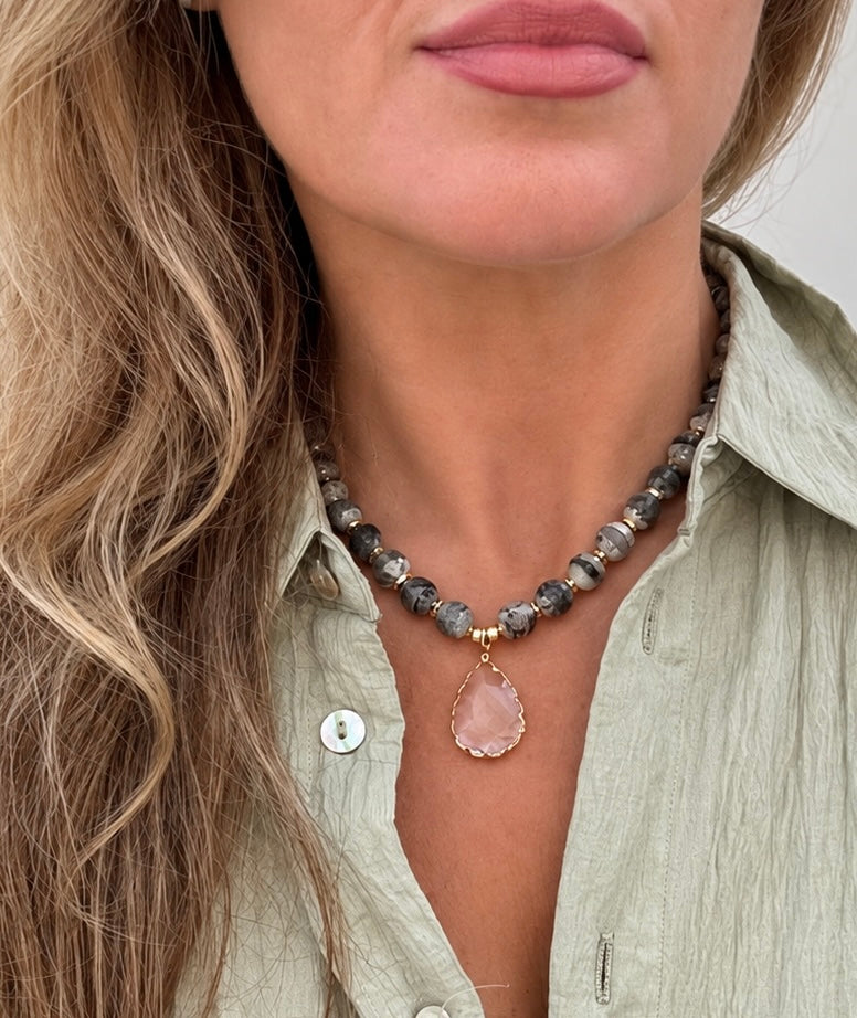 a woman wearing a necklace