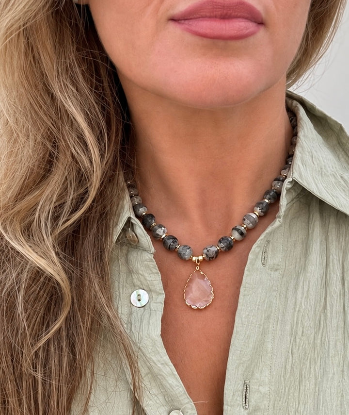 a woman wearing a necklace