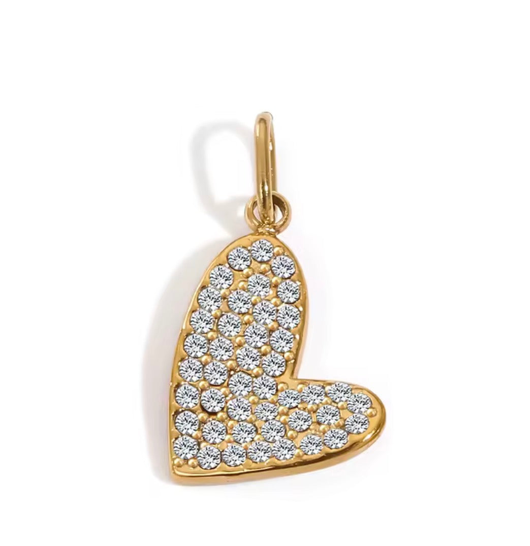 a gold heart with diamonds