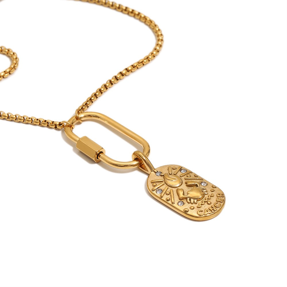 a gold necklace with a pendant