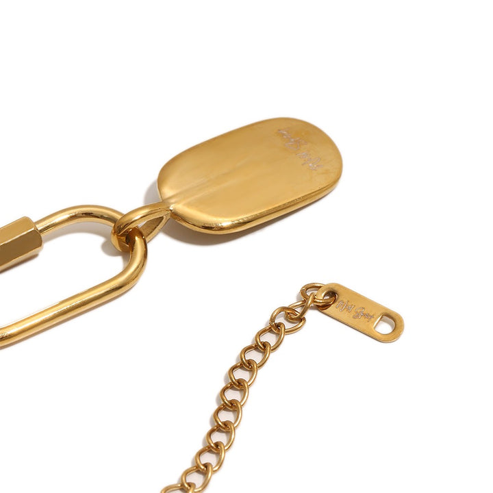 a gold chain and a key chain