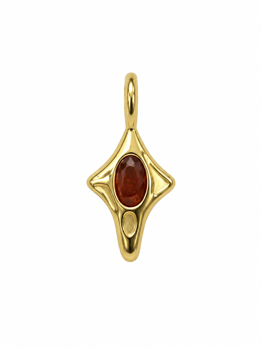 a gold pendant with a red stone
