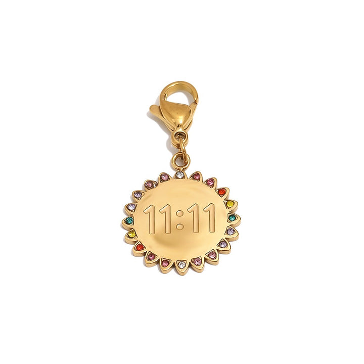 a gold medallion with multicolored stones