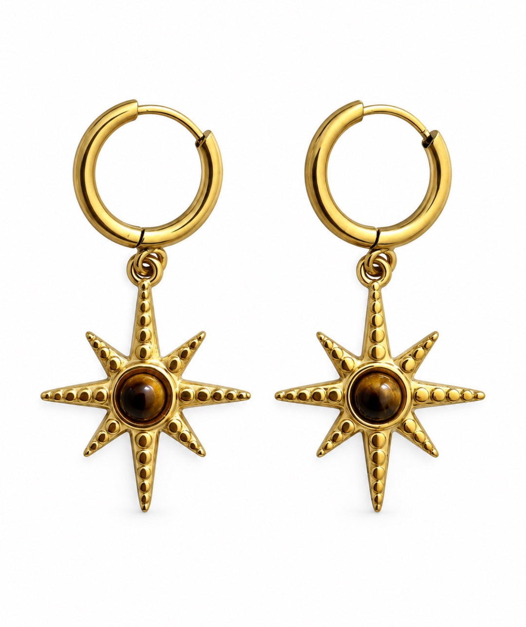 a pair of gold earrings with a star design