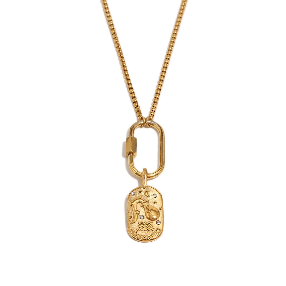a gold necklace with a pendant