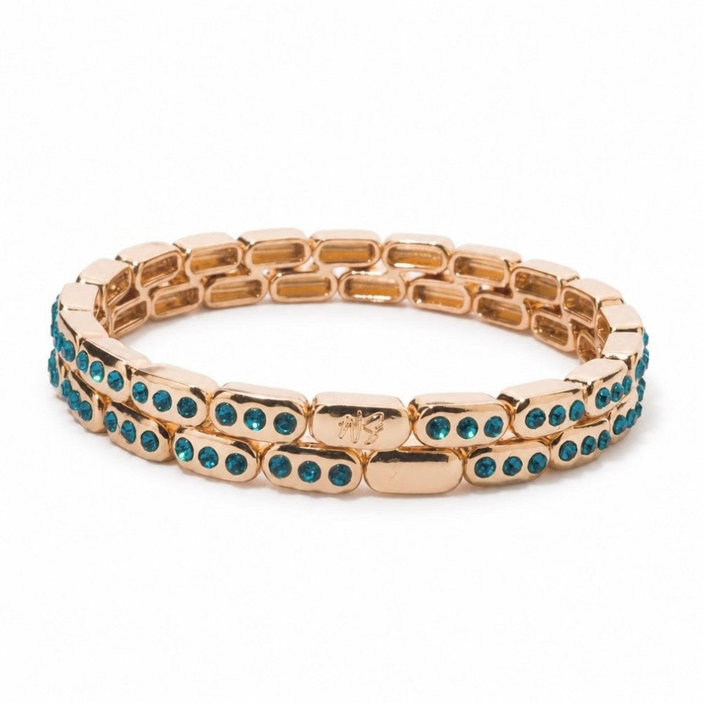 a gold bracelet with blue stones