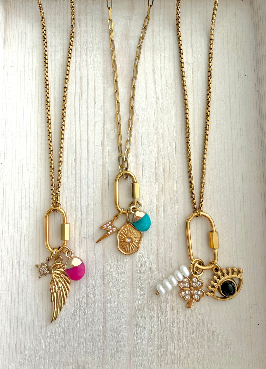 a group of gold necklaces