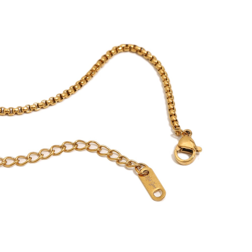 a gold chain with a clasp
