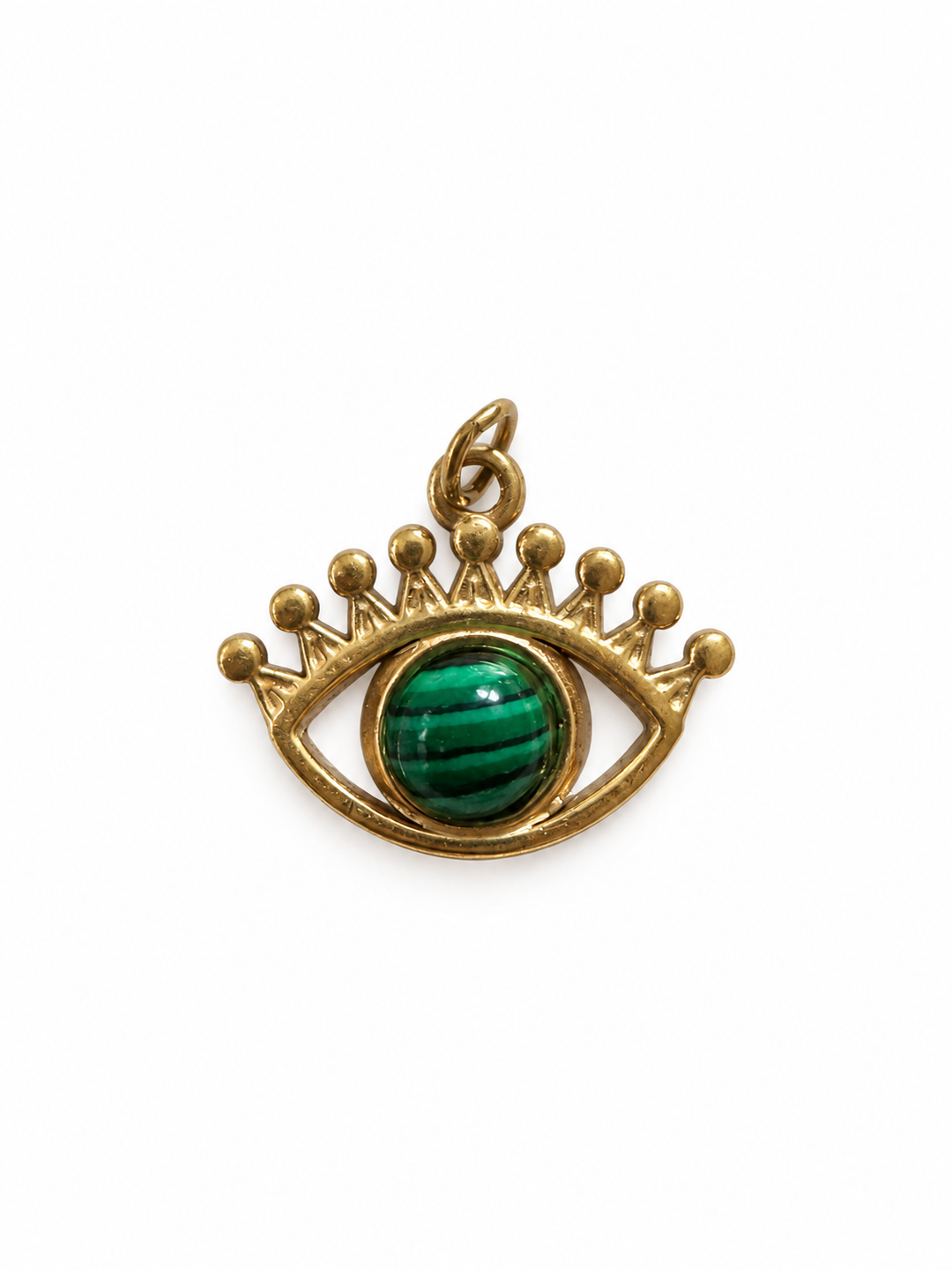 a gold and green pendant with a green eye