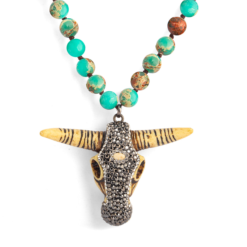 a necklace with a skull pendant