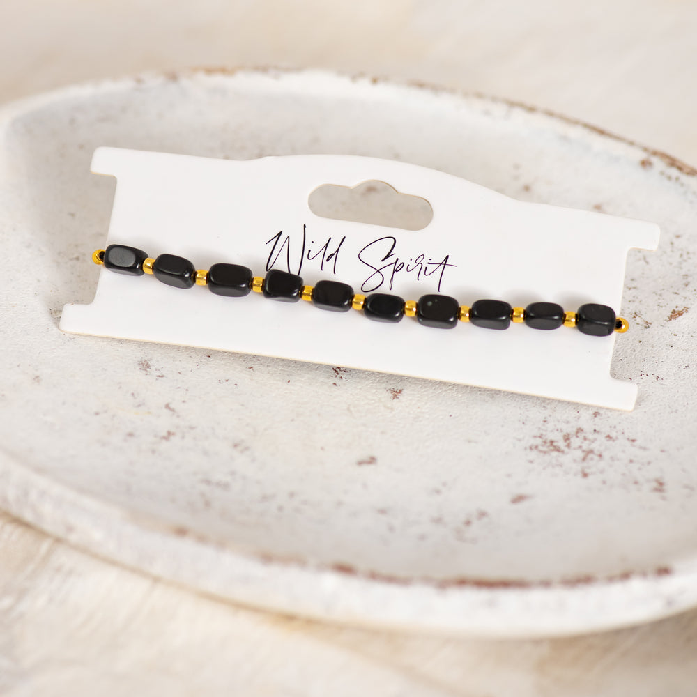 a bracelet on a plate